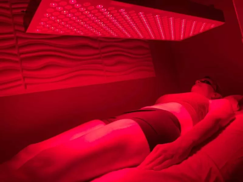 woman in red light therapy
